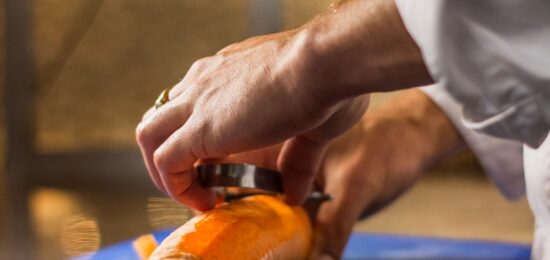 man peeling carrot