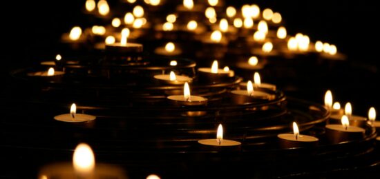 low-angle photo of lightened candles