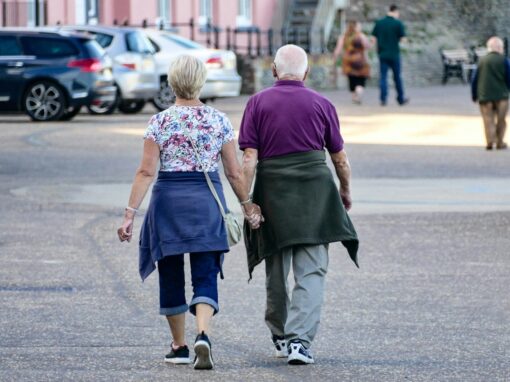 man and woman walking on the street during daytime