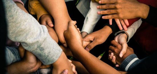 a group of people holding hands