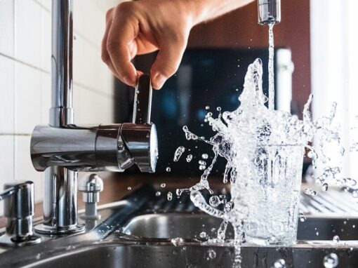 person opening faucet
